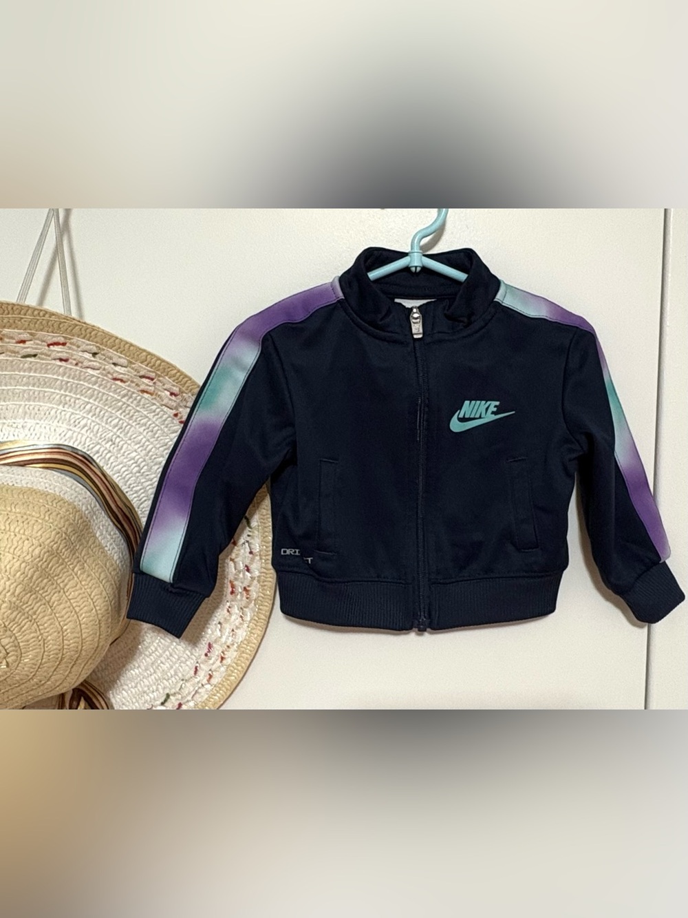 Nike Navy Blue Jacket with Teal Logo and Purple-Teal Shoulder Stripes
